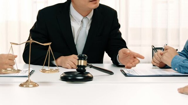 Lawyer act as mediator offer a compromise between two parties to resolve business dispute through negotiation at law firm office. Legal mediation and conflict resolution service. Slow motion. Rigid.