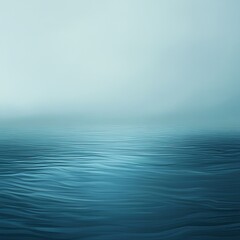 Obraz premium Serene Blue Water with Misty Horizon