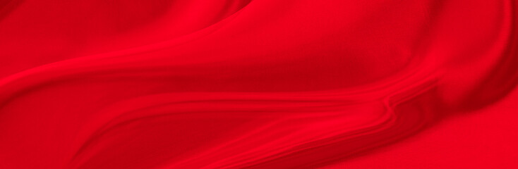 Black red satin dark fabric texture luxurious shiny that is abstract silk cloth background with patterns soft waves blur beautiful.