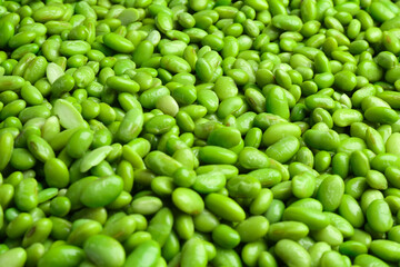Fresh edamame beans as background, closeup view