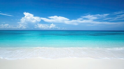 Serene beach with soft and a clear blue sky