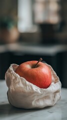 Red apple in soft focus with natural light. Minimalist still life concept
