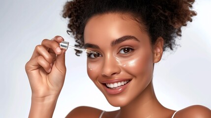 Obraz premium Smiling Afro-American Woman Applying Hyaluronic Acid Serum, Enriched with Vitamin C and Niacinamide for Hydration and Radiant Skin, Solid White Background.