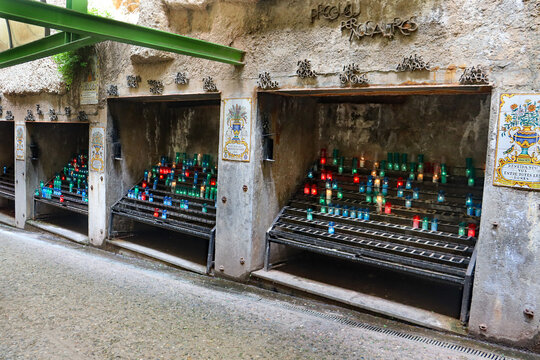 Catalonia, Spain on May 21, 2024. View of prayer candles on special holder at the Basilica of Santa Maria de Montserrat monastery in Catalonia, Spain.