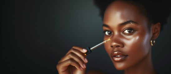 Obraz premium Afro-American Woman Applying Hyaluronic Acid Serum, Enriched with Vitamin C and Niacinamide for Hydration and Radiant Skin, Copy Space