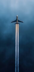 A dramatic view of an airplane soaring through a dark sky, leaving behind a trail of vapor against the moody backdrop.