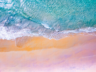 Top view waves crashing on sandy shore, Beach sea space nature background