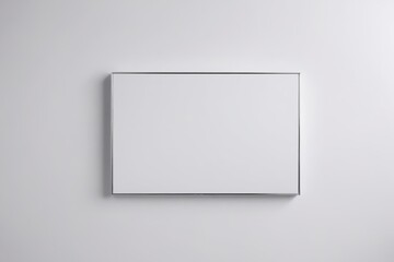 a white square frame hanging on a wall                             