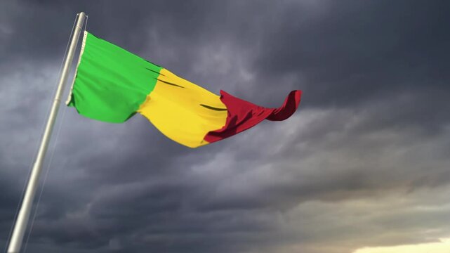 Mali flag waving on heavy sunrise clouds at shower rains backdrop