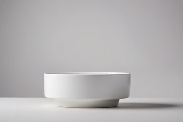 a white bowl on a table                               
