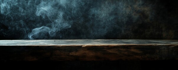 Wooden table with smoke on dark background