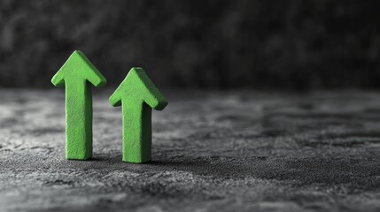 Photo of 2 green arrows made of plasticine pointing up. 3D mockup arrow sign pointing increasing direction on grey background. Development concept business success prosperity and growth.