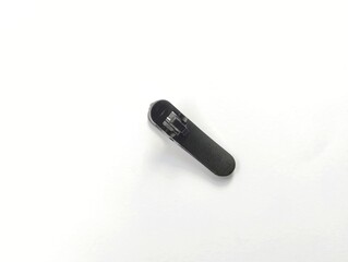 Black microphone clip on white background.