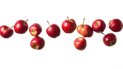 Red apples isolated mid-fall against a white background