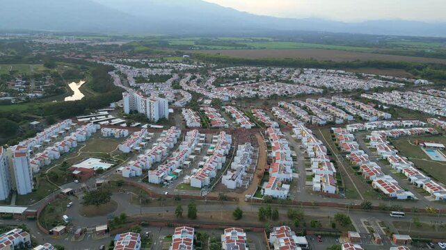 Aerial Landscape of Suburban Neighborhood at Sunset. Jamundi Valle del Cauca Colombia. Pull Back.