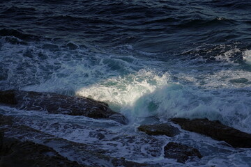 waves breaking on the rocks