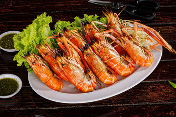 Shrimp are grilled in Thai style, and the food is famous in Thailand, including local seafood with spicy seafood sauce.