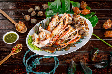  Grilled prawns, squids, and clams with spicy and sour dipping sauce packed with Thai seafood flavor.