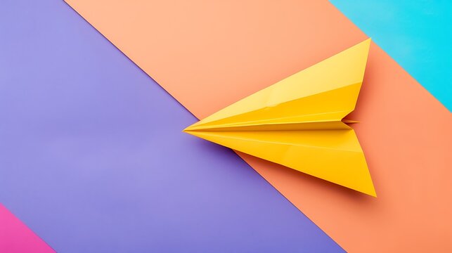 Top view of single yellow paper airplane with customizable space for text isolated on colorful background