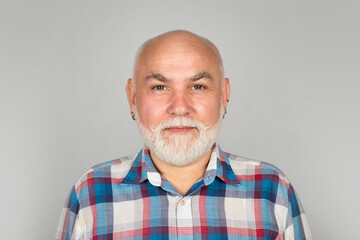 Obraz premium Golden age grandfather. Middle aged man on studio isolated background. Close up portrait of grey-haired mature senior man. Grandfather pensioner, retiree concept.