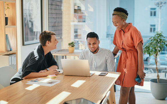 Creative, collaboration and business people with laptop in meeting for design strategy, online campaign and website layout. Graphic designer, team and laughing in boardroom for project brainstorming