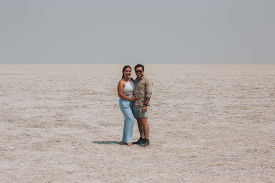 couple on the beach - Powered by Adobe