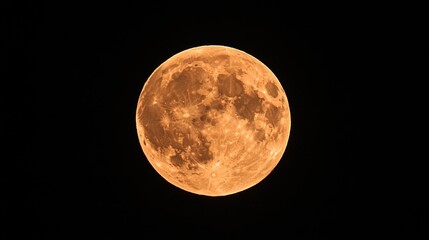 A large orange moon is in the sky