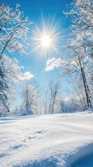 Obraz premium A bright blue sky over glistening snow covered winter landscape creates serene and peaceful atmosphere. sun shines brilliantly, illuminating snowy scene with magical glow