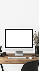 Fototapeta premium A blank computer monitor screen on wooden desk creates minimalist workspace. setup includes keyboard, stationery, and potted plant, evoking calm and organized atmosphere