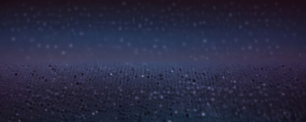 Obraz premium a blurred, abstract background with a gradient of blue and purple hues, resembling a night sky or a starry night.