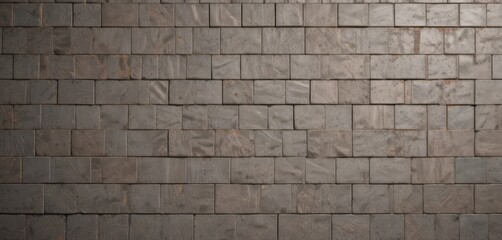Obraz premium a close-up view of a brick wall composed of rectangular bricks, with a uniform gray color and a slightly uneven texture.