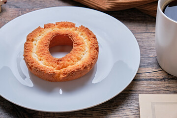 Old Fashioned Donuts and Coffee on Wooden Table