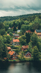 Fototapeta premium Picturesque Swedish village on edge of vast forest, surrounded by lush greenery and serene lake. charming houses reflect traditional architecture, creating tranquil atmosphere