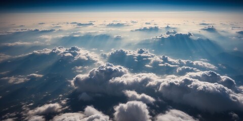 Majestic Aerial View of Fluffy Clouds Blanketing the Earth from High Altitude Flight.