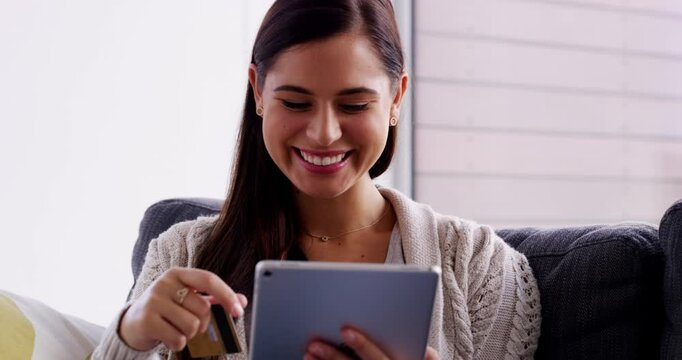 Tablet, smile and woman on a sofa with credit card for ecommerce, loan or payment in her home. Digital, app and female person in a living room for online shopping, relax or sign up, code or password