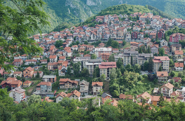 Fototapeta premium View of the small town with high-rise buildings and streets