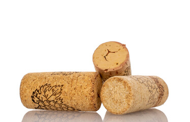 Three wine corks, macro, isolated on white background.