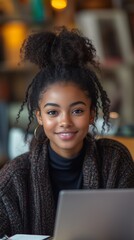 Fototapeta premium Afro-American Female Student Smiling and Engaged in E-Learning, Online Education, Remote Learning, and Digital Education at Home, Studying for University and Bootcamp Courses.
