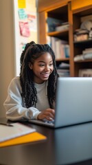 Afro-American Female Student Smiling and Engaged in E-Learning, Online Education, Remote Learning, and Digital Education at Home, Studying for University and Bootcamp Courses.