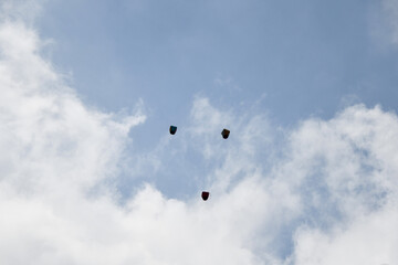 A paper balloon flying into the sky with a wish