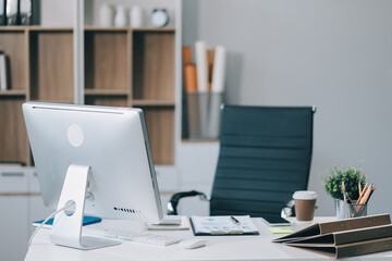 Young attractive businesswoman working on her project with laptop computer in modern office room.