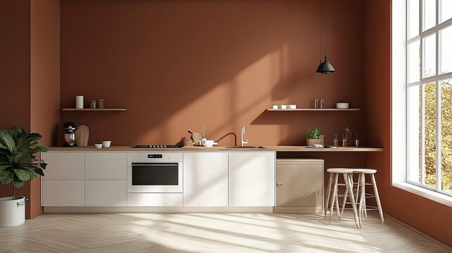 Modern kitchen interior with white cabinets, wooden countertops, and a terracotta wall. Sunlight streams through a large window.