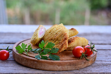  Crispy  deep fried home made     chicken breast on wooden rustic background.  