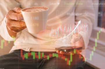Financial and investment Business Data analysis businessman working with virtual data chart using smartphone and holding coffee cup sitting in cafe