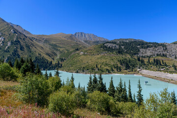 Beautiful mountain lake, forest and mountains. Big Almaty lake in summer time. Mountain landscape in Kazakhstan.