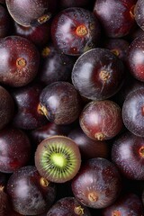 Fototapeta premium Actinidia arguta texture background, hardy kiwi fruits pattern, many perennial vine mockup, kiwifruit berries