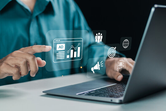 Businessman using laptop with advertising on website for planning advertising marketing strategies to target social media native, ad, advertisers, sales.