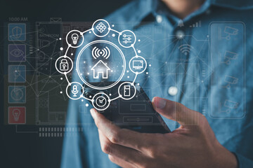 Man use smartphone to manage smart home features including security, lighting, and temperature. Smart home and Iot concept.