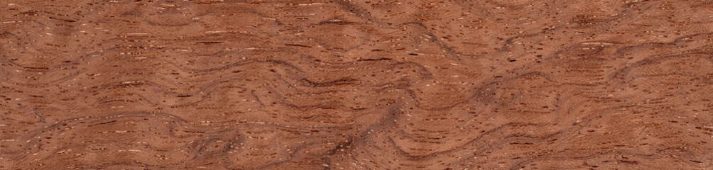 Bubinga pommele veneer with undulating grain patterns and warm terracotta tones