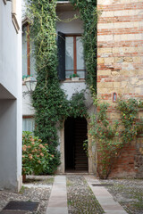 Entrance to an old house in the old town of Verona, Italy